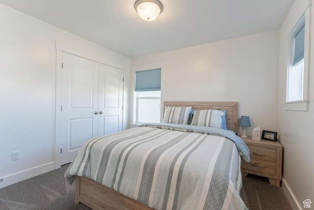 3048 S 400 W, Nibley, UT 84321 - bedroom featuring a closet, baseboards, multiple windows, and carpet floors