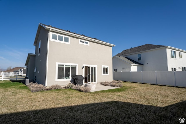 3048 S 400 W, Nibley, UT 84321 - rear view of house with fence, a lawn, and stucco siding