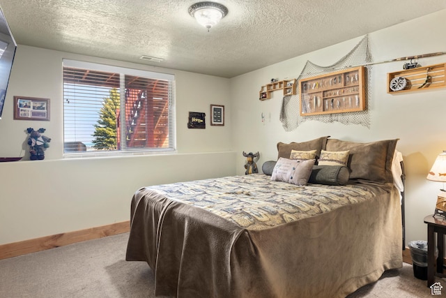 17 Wedge Way, Garden City, UT 84028 - carpeted bedroom with a textured ceiling and baseboards