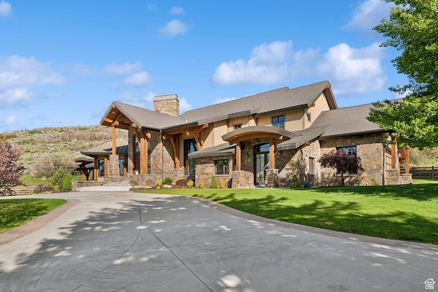 2499 River Meadows Ln, Midway, UT 84049 - view of front of home with stone siding, a chimney, and a front lawn