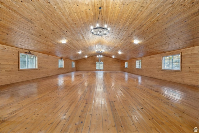 2499 River Meadows Ln, Midway, UT 84049 - spare room featuring wood ceiling, wooden walls, lofted ceiling, hardwood / wood-style floors, and a chandelier