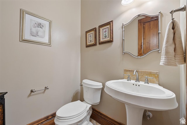 2499 River Meadows Ln, Midway, UT 84049 - bathroom with toilet and tasteful backsplash