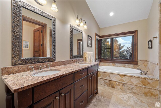 2499 River Meadows Ln, Midway, UT 84049 - full bathroom featuring lofted ceiling, double vanity, and a garden tub