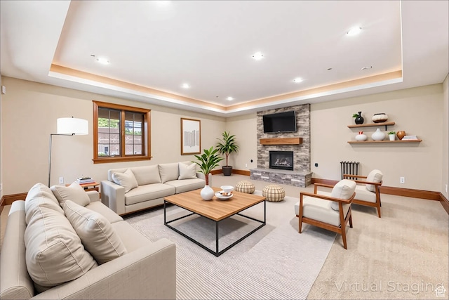 2499 River Meadows Ln, Midway, UT 84049 - living room with a raised ceiling, a stone fireplace, recessed lighting, and light colored carpet