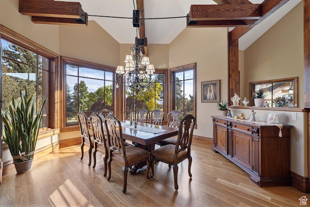 2499 River Meadows Ln, Midway, UT 84049 - dining area with high vaulted ceiling, a chandelier, and light wood-style flooring