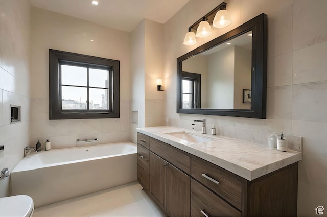 2499 River Meadows Ln, Midway, UT 84049 - bathroom with tile walls, vanity, a garden tub, and tile patterned flooring