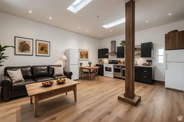 2499 River Meadows Ln, Midway, UT 84049 - living room featuring a skylight and light wood-style flooring