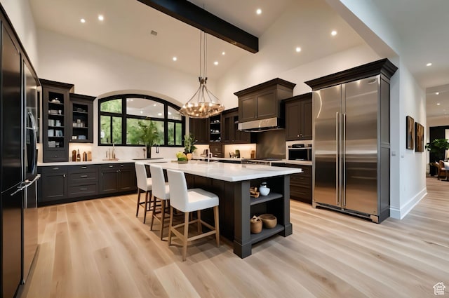 2499 River Meadows Ln, Midway, UT 84049 - kitchen with appliances with stainless steel finishes, open shelves, light countertops, recessed lighting, and light wood-style flooring