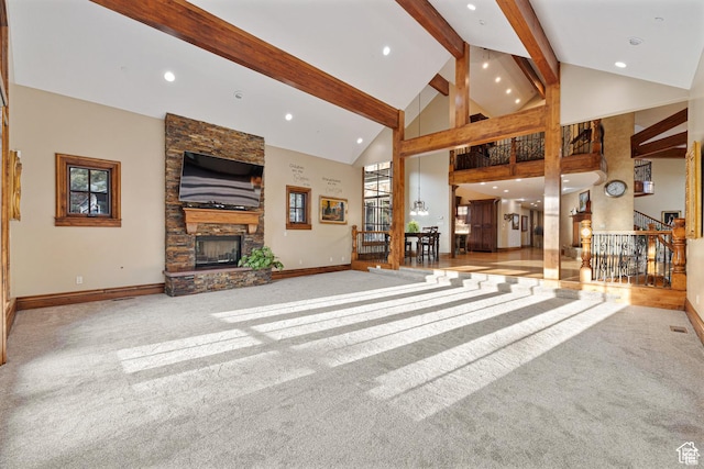 2499 River Meadows Ln, Midway, UT 84049 - unfurnished living room featuring carpet floors, a stone fireplace, high vaulted ceiling, beamed ceiling, and recessed lighting