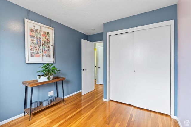 108 W 4300 S, Washington Terrace, UT 84405 - bedroom with a closet, baseboards, and wood finished floors