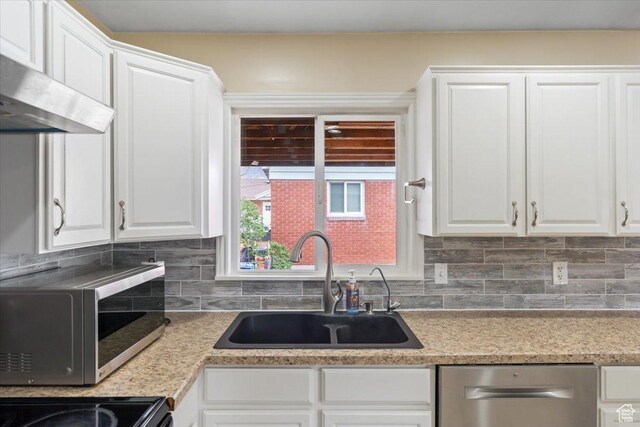 108 W 4300 S, Washington Terrace, UT 84405 - kitchen featuring tasteful backsplash, white cabinets, a sink, wall chimney range hood, and stainless steel dishwasher