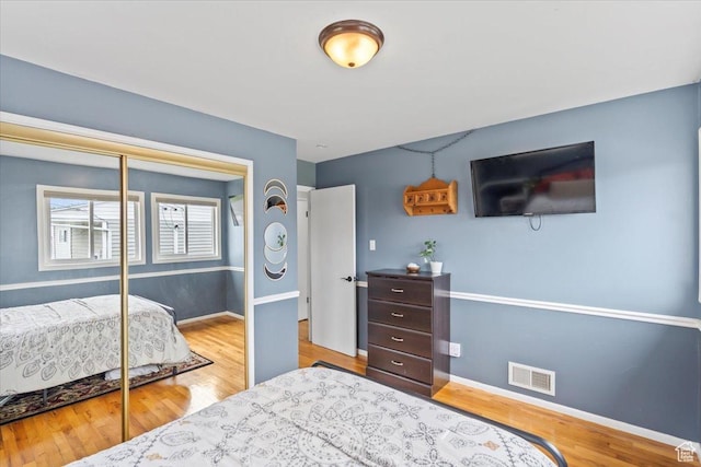 108 W 4300 S, Washington Terrace, UT 84405 - bedroom featuring a closet, visible vents, baseboards, and wood finished floors