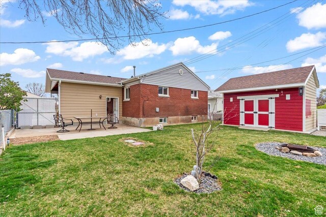 108 W 4300 S, Washington Terrace, UT 84405 - rear view of property featuring a patio, an outdoor structure, a yard, fence, and a storage unit
