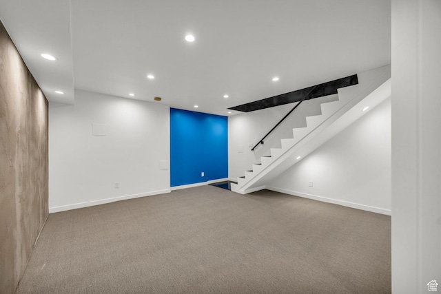 interior space featuring recessed lighting, baseboards, and stairs