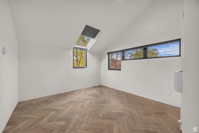 bonus room with high vaulted ceiling and a skylight