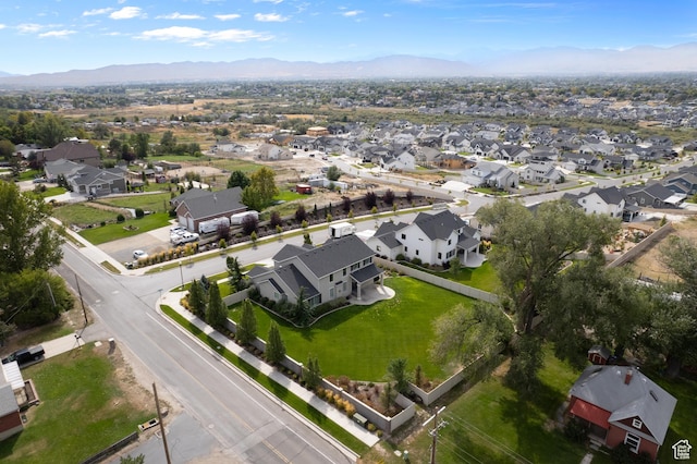 birds eye view of property with a mountain view and a residential view