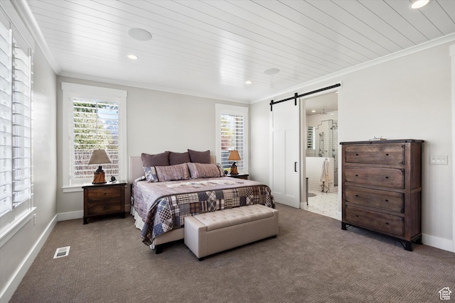 carpeted bedroom featuring ornamental molding, visible vents, recessed lighting, and a barn door