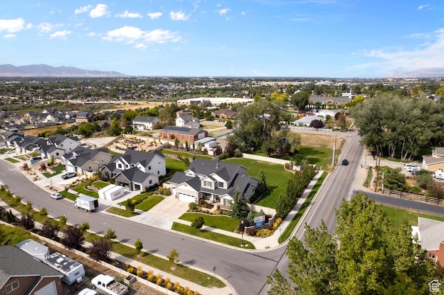birds eye view of property with a residential view and a mountain view