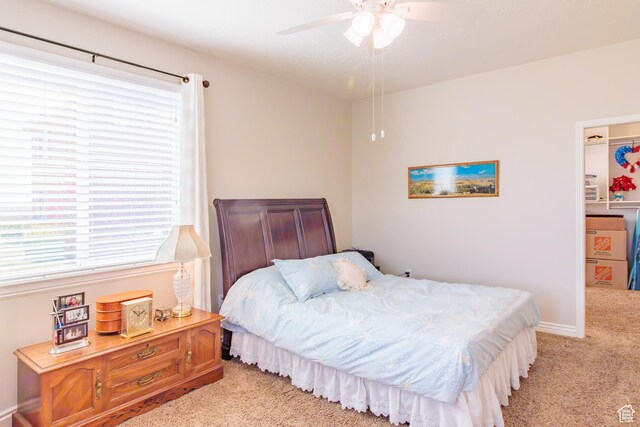 502 S 1040 E Unit 133, American Fork, UT 84003 - bedroom with light carpet, ceiling fan, baseboards, and a spacious closet
