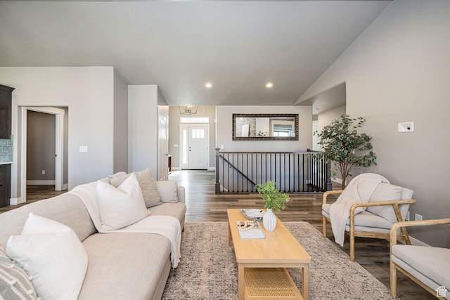 living area with wood finished floors, baseboards, vaulted ceiling, and recessed lighting