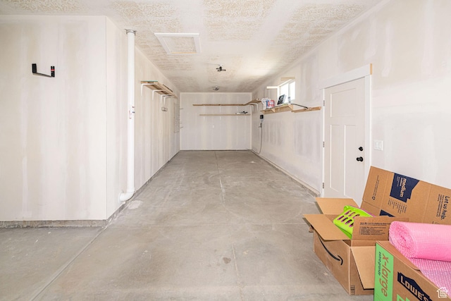 hall with unfinished concrete flooring