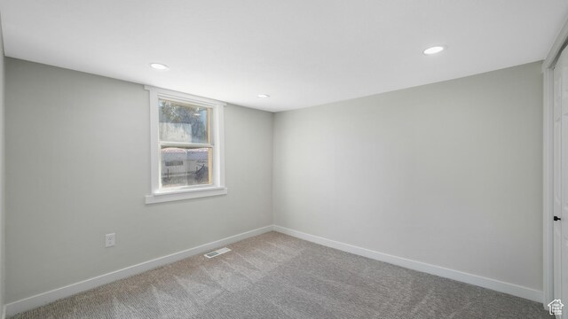 55 S Cooley St, Grantsville, UT 84029 - carpeted spare room with baseboards, visible vents, and recessed lighting
