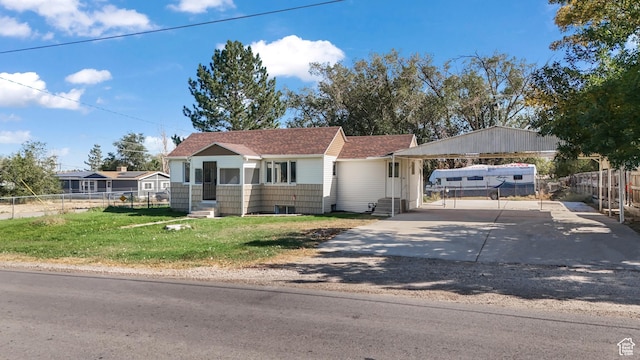 55 S Cooley St, Grantsville, UT 84029 - view of front facade with entry steps, driveway, a front yard, and fence