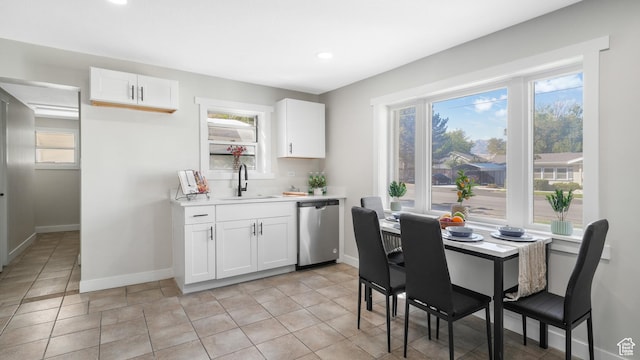 55 S Cooley St, Grantsville, UT 84029 - kitchen featuring a sink, light countertops, dishwasher, and baseboards