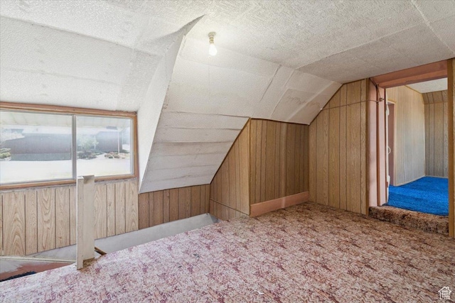 205 S Main St, Manti, UT 84642 - bonus room featuring wood walls, carpet, and lofted ceiling