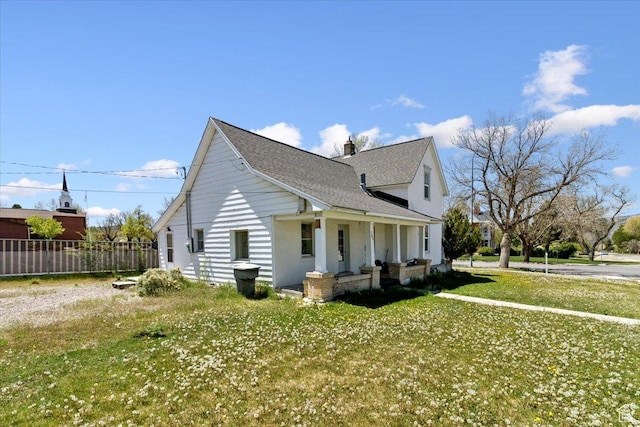 205 S Main St, Manti, UT 84642 - view of side of property featuring covered porch, a shingled roof, and a chimney