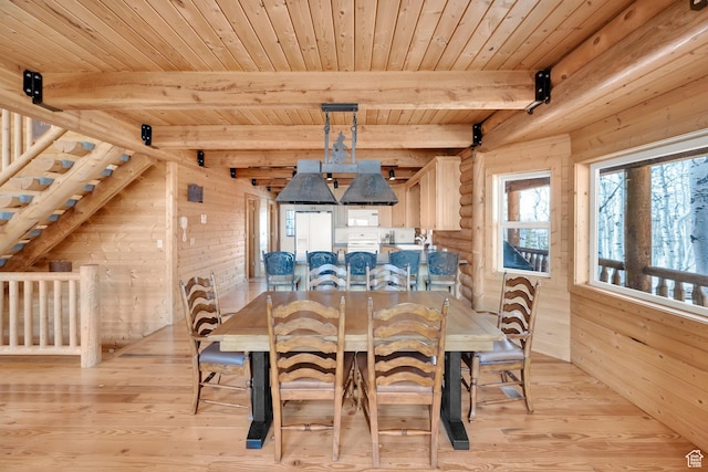11551 E Marigold Ln Unit 1659, Heber City, UT 84032 - dining room featuring light wood-style flooring, wood ceiling, wooden walls, and beamed ceiling