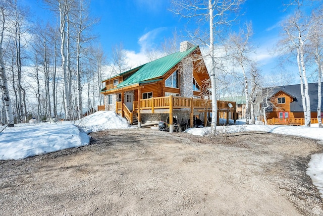 11551 E Marigold Ln Unit 1659, Heber City, UT 84032 - snow covered property with stone siding and a chimney