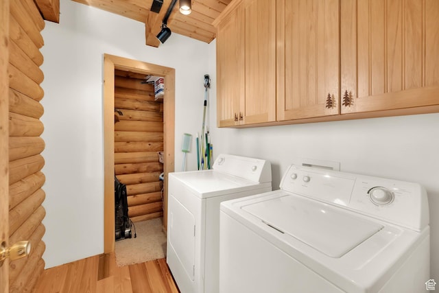 11551 E Marigold Ln Unit 1659, Heber City, UT 84032 - laundry room with light wood-style floors, rustic walls, wooden ceiling, washer and dryer, and cabinet space