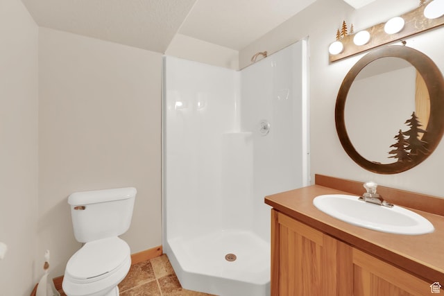 11551 E Marigold Ln Unit 1659, Heber City, UT 84032 - bathroom featuring toilet, a stall shower, baseboards, and vanity