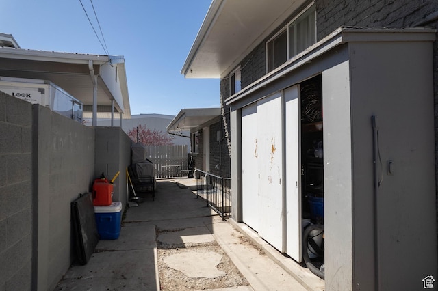 view of home's exterior with fence