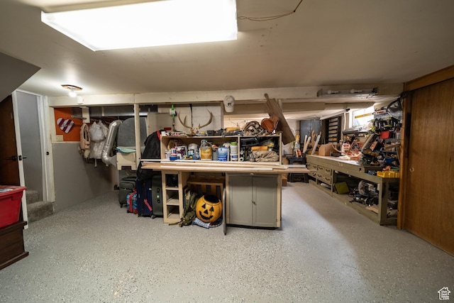 finished below grade area with a workshop area