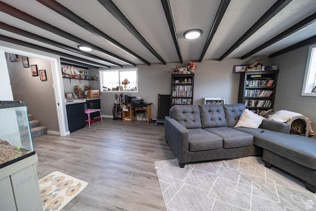 living area featuring light wood finished floors and baseboards