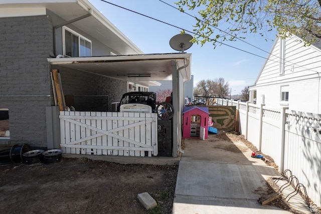 view of side of property featuring fence