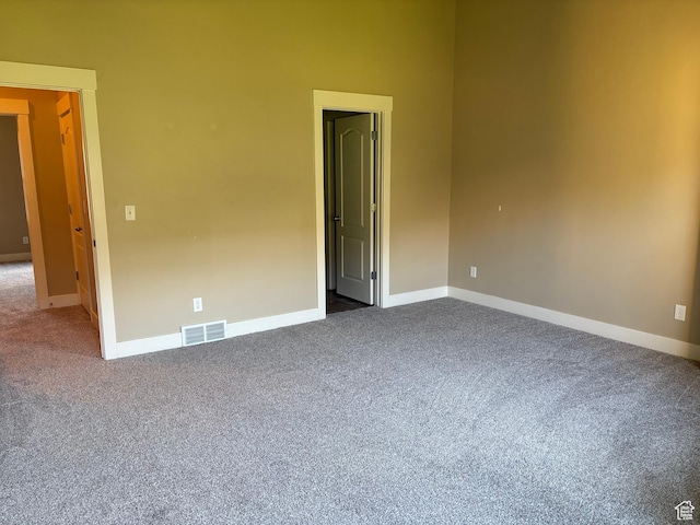 162 W Barry Links Way S, South Salt Lake, UT 84115 - empty room with dark carpet and baseboards