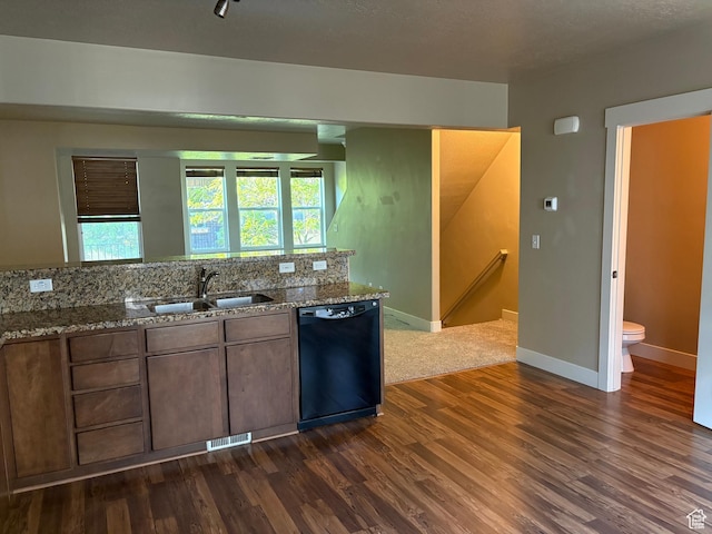 162 W Barry Links Way S, South Salt Lake, UT 84115 - kitchen featuring dishwasher, a sink, dark wood finished floors, stone countertops, and baseboards