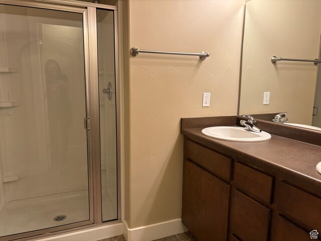 162 W Barry Links Way S, South Salt Lake, UT 84115 - bathroom featuring a shower stall, vanity, and baseboards