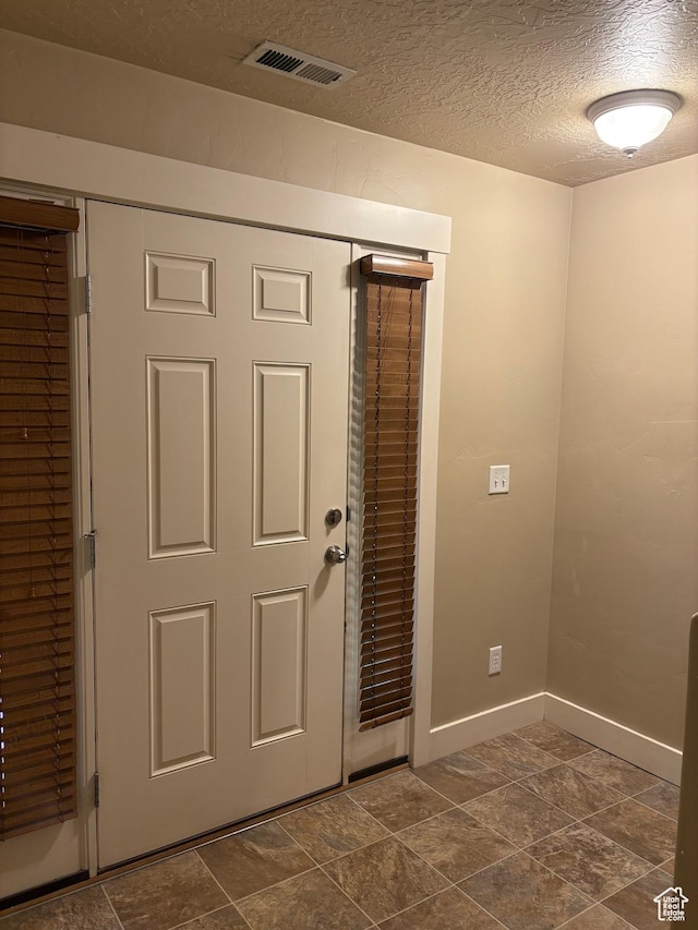162 W Barry Links Way S, South Salt Lake, UT 84115 - foyer entrance with a textured ceiling and baseboards