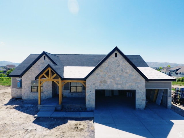 1362 S 1960 W Unit 3, Lehi, UT 84043 - view of front of home with stone siding, a garage, concrete driveway, and roof with shingles