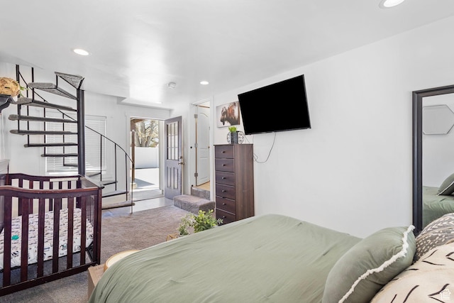 bedroom with recessed lighting and access to outside