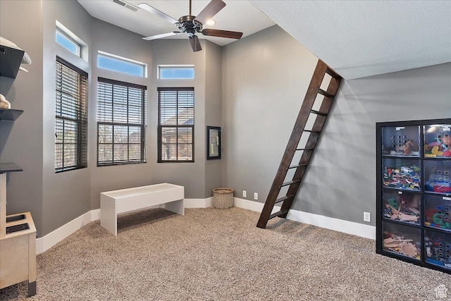 bedroom featuring baseboards, multiple windows, and carpet flooring