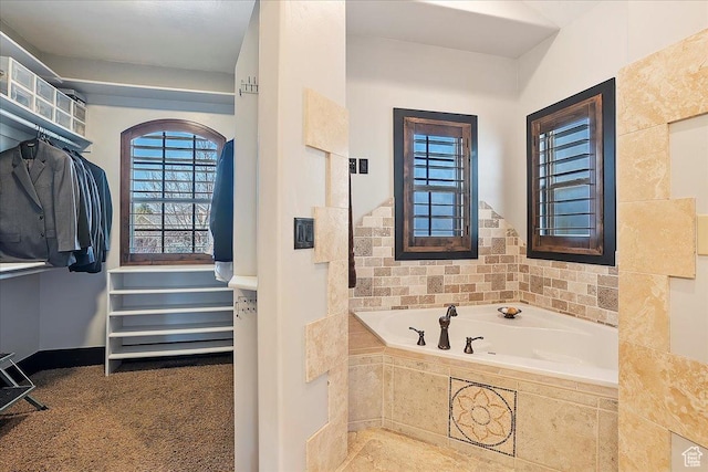 bathroom with a garden tub