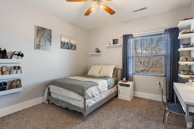 bedroom featuring visible vents, baseboards, a ceiling fan, and light colored carpet