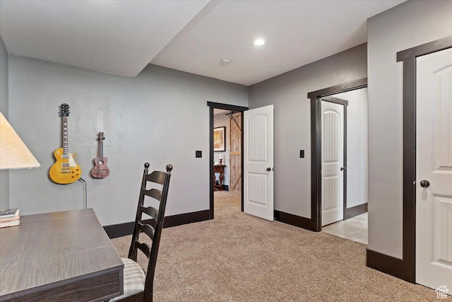 home office featuring light colored carpet and baseboards