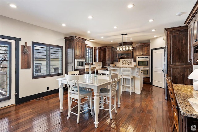 dining space featuring visible vents, baseboards, recessed lighting, and dark wood finished floors