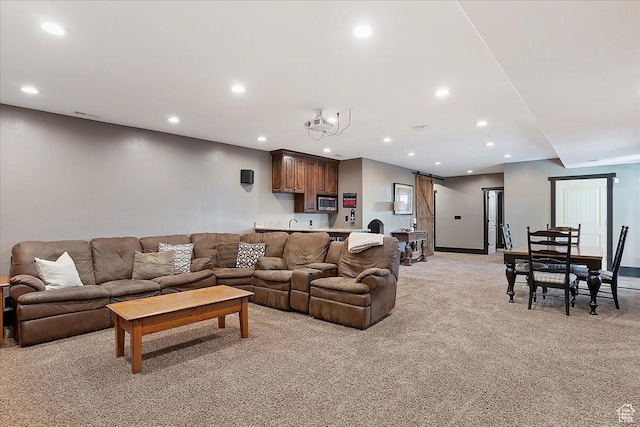 living room featuring light carpet, baseboards, visible vents, and recessed lighting